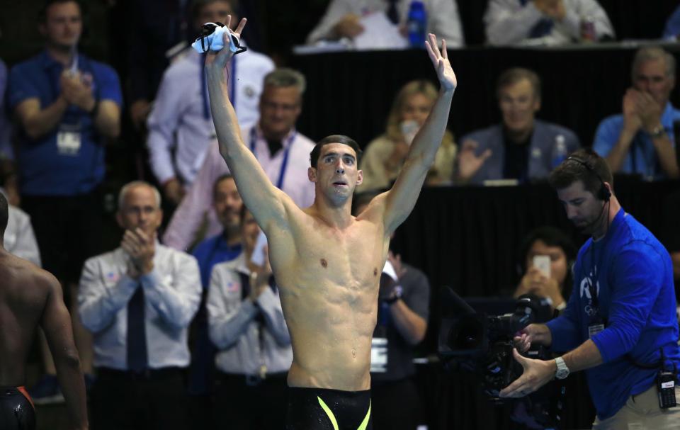 Michael Phelps reacts after winning the men's 100-meter butterfly at the U.S Olympic swimming trials. (AP)