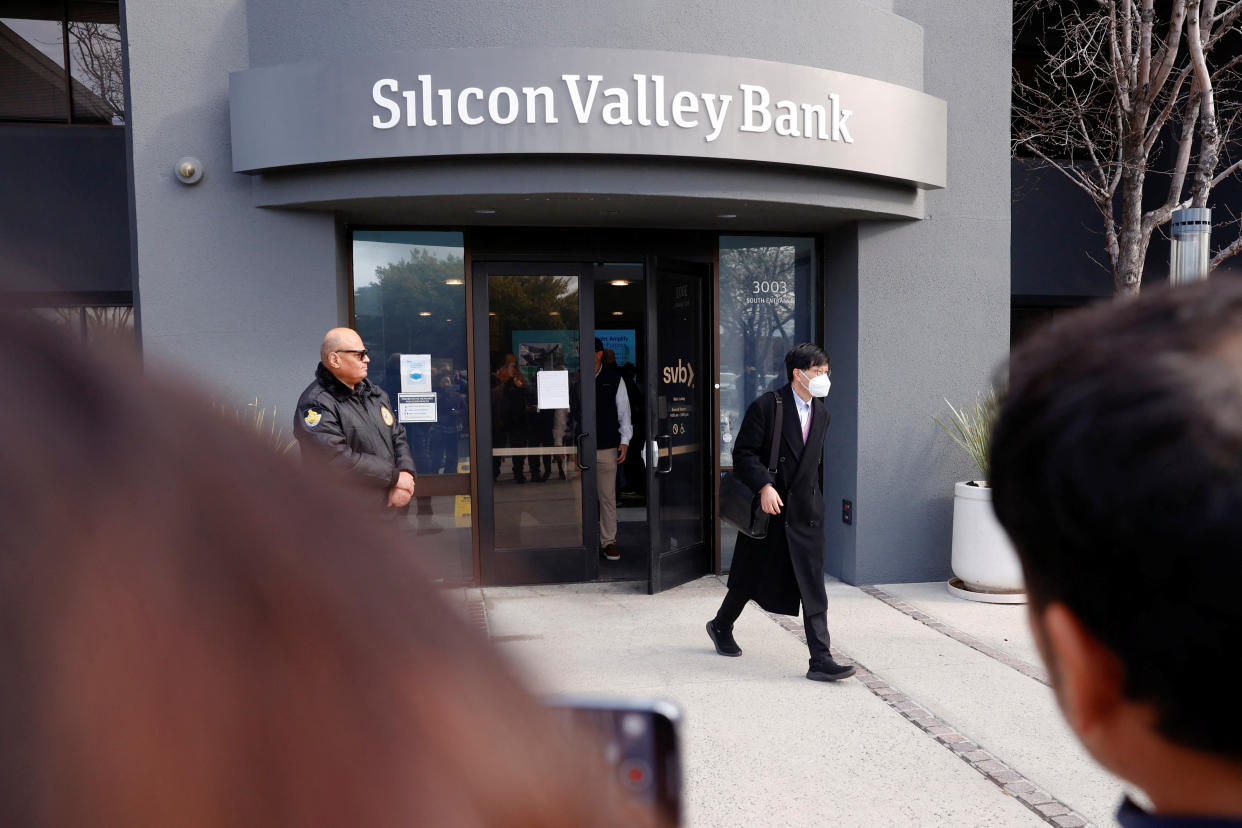 Cryptocurrency A customer leaves after speaking with FDIC representatives inside of the Silicon Valley Bank headquarters in Santa Clara, California, U.S., March 13, 2023. REUTERS/Brittany Hosea-Small