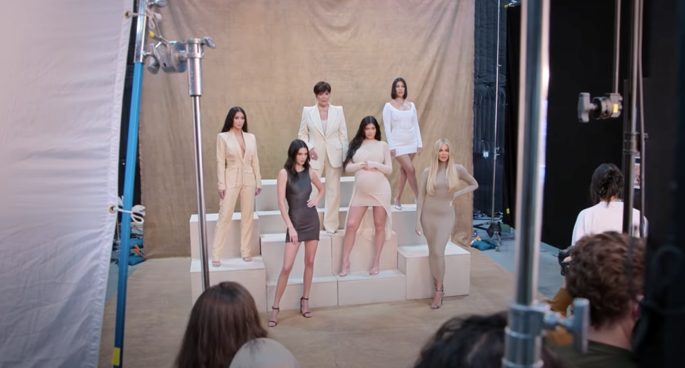 The family members posing on podiums