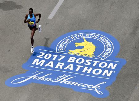 Apr 17, 2017; Boston, MA, USA; Edna Kiplagat runs down Boylston Street towards the finish line of the 2017 Boston Marathon. Kiplagat took first place in the women's division. Brian Fluharty-USA TODAY Sports