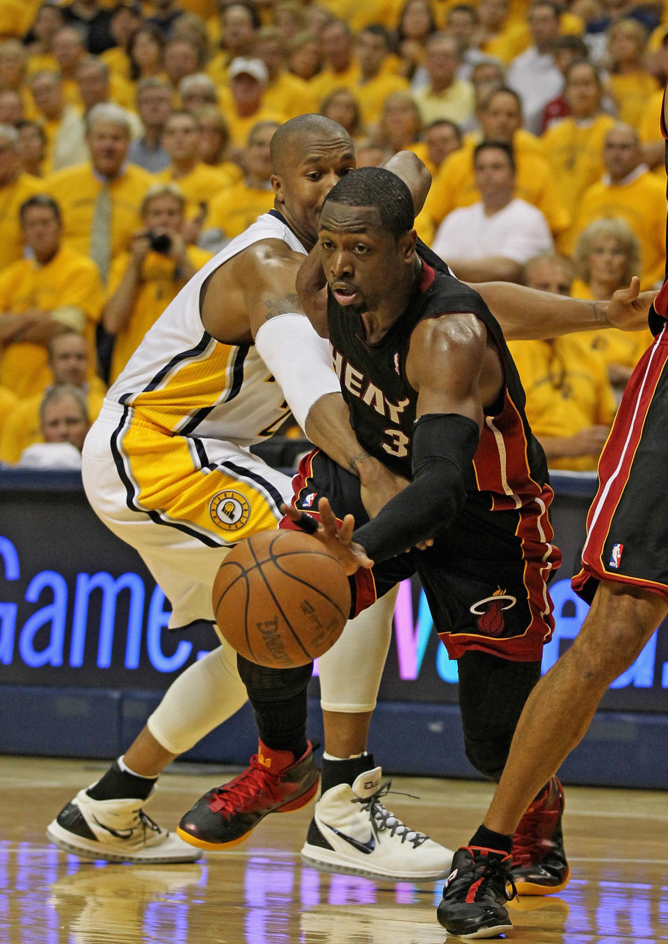 INDIANAPOLIS, IN - MAY 24: Dwyane Wade #3 of the Miami Heat drives past David West #21 of the Indiana Pacers in Game Six of the Eastern Conference Semifinals in the 2012 NBA Playoffs at Bankers Life Fieldhouse on May 24, 2012 in Indianapolis, Indiana. NOTE TO USER: User expressly acknowledges and agrees that, by downloading and/or using this photograph, User is consenting to the terms and conditions of the Getty Images License Agreement. (Photo by Jonathan Daniel/Getty Images)