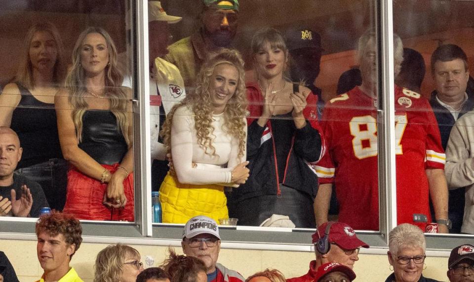 Brittany Mahomes (in yellow), co-owner of the KC Current soccer team and wife of Chiefs quarterback Patrick Mahomes, watched the game Thursday night with new friend Taylor Swift. Nick Wagner/nwagner@kcstar.com