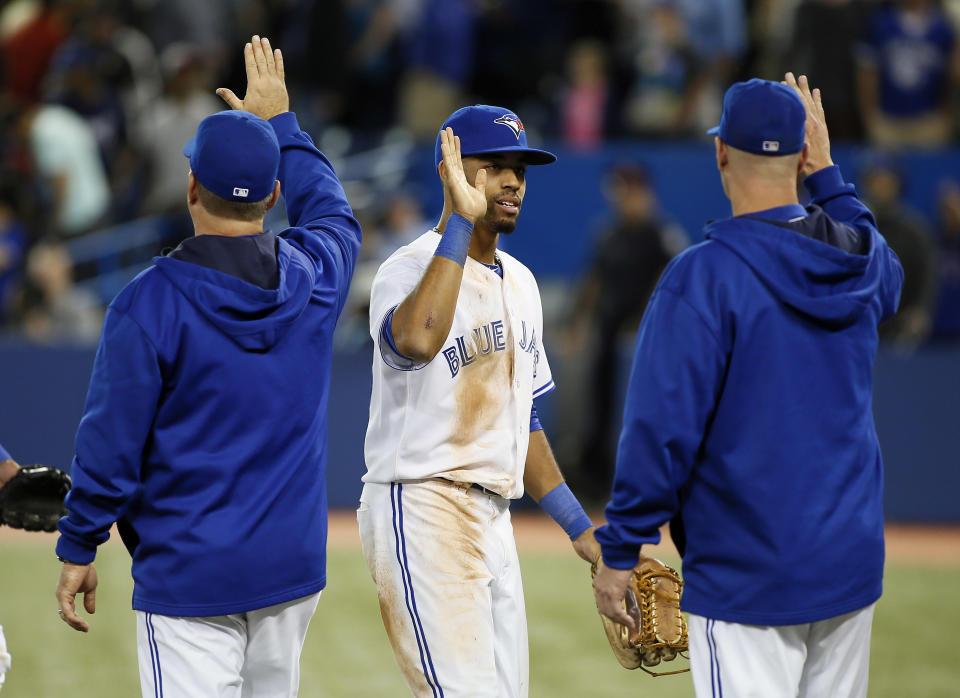 Toronto Blue Jays left fielder Dalton Pompey (45) gets congratulated after a win over the Baltimore Orioles at Rogers Centre. Toronto defeated Baltimore 4-2. (John E. Sokolowski-USA TODAY Sports)