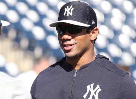 FILE PHOTO: Mar 15, 2019; Tampa, FL, USA; Seattle Seahawks quarterback Russell Wilson works out prior to the game between the New York Yankees and Boston Red Sox at George M. Steinbrenner Field. Mandatory Credit: Kim Klement-USA TODAY Sports