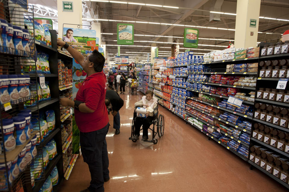 In this Nov. 18, 2011 photo, people shop at a Wal-Mart Superstore in Mexico City. Wal-Mart Stores Inc. hushed up a vast bribery campaign that top executives of its Mexican subsidiary carried out to build stores across Mexico, according to a published report by the New York Times. (AP Photo)