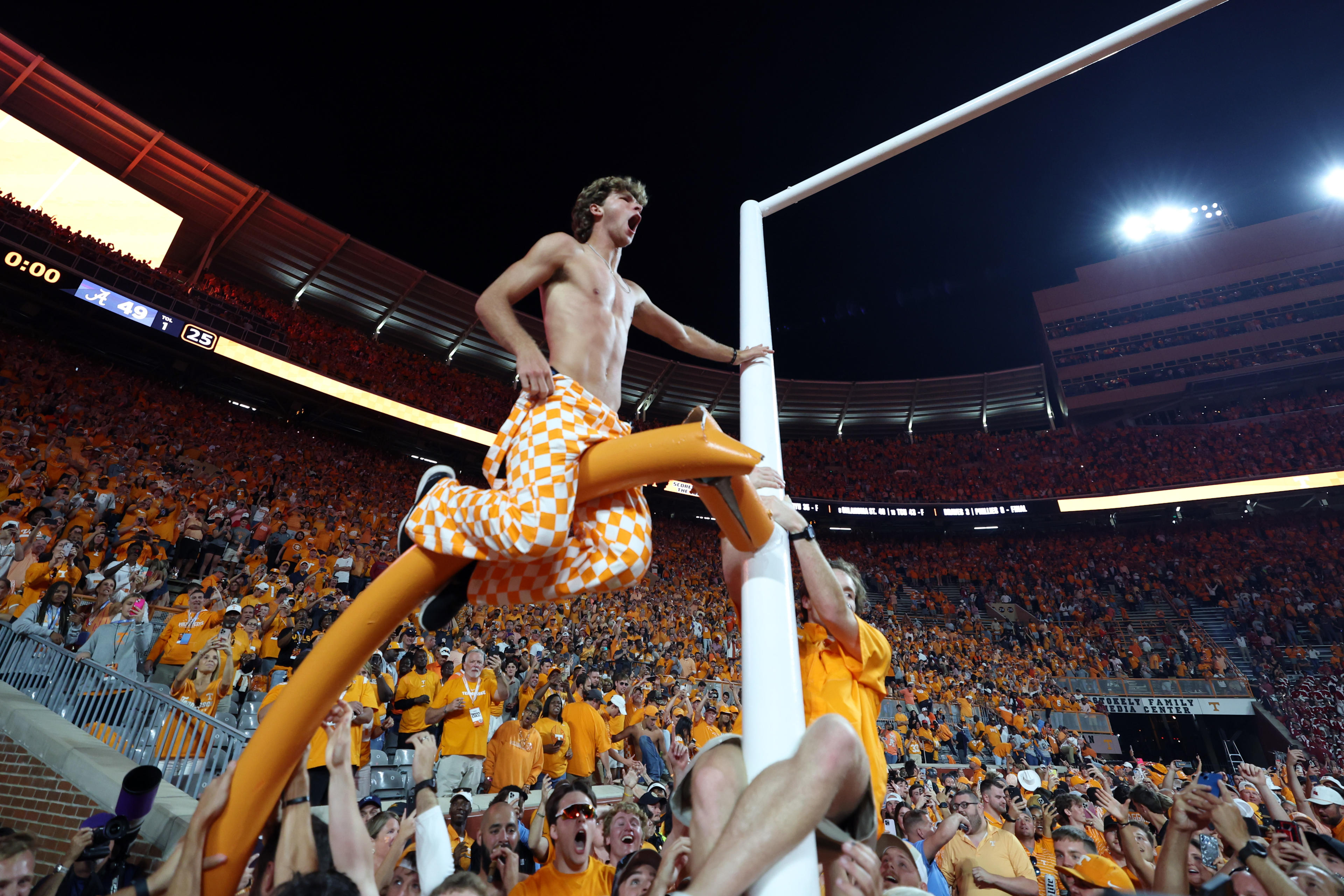 KNOXVILLE, TENNESSEE - OCTOBER 15: Tennessee Volunteers fans tear down the goal post while celebrating a win over the Alabama Crimson Tide at Neyland Stadium on October 15, 2022 in Knoxville, Tennessee. Tennessee won the game 52-49. (Photo by Donald Page/Getty Images)