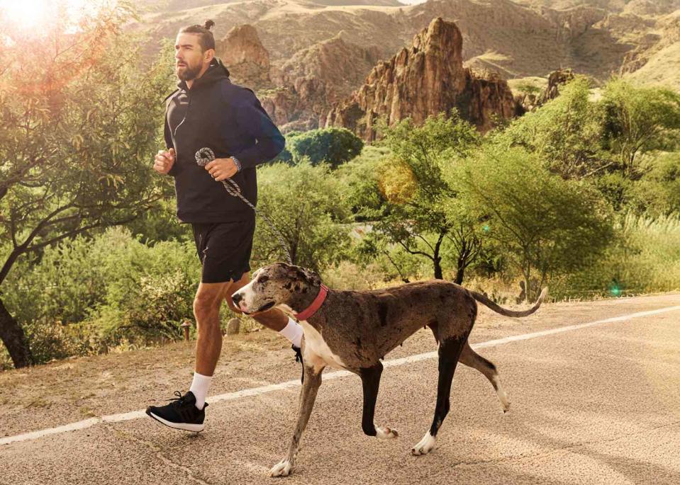 <p>Purina Pro Plan</p> Michael Phelps running with his dog, Onyx