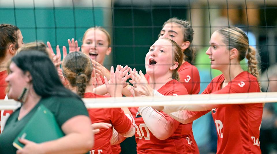 The Barnstable team celebrates on Sept. 18 after holding off Dennis-Yarmouth in the 4th set to win 3-1 in volleyball.