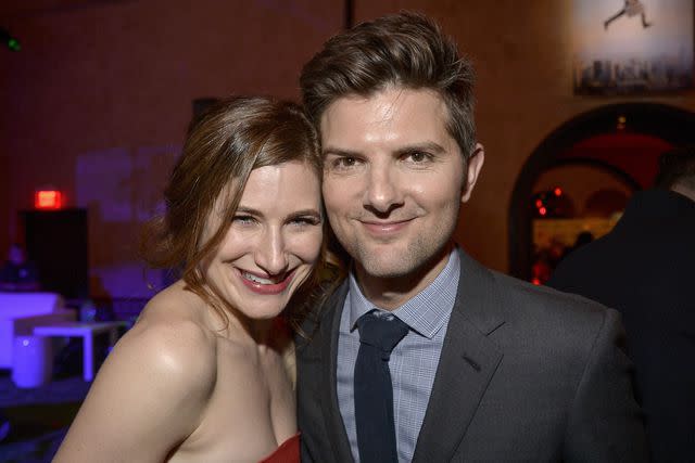 <p>Frazer Harrison/Getty</p> Kathryn Hahn and Adam Scott, seen here at a 2013 film premiere, played husband and wife in "Step Brothers"
