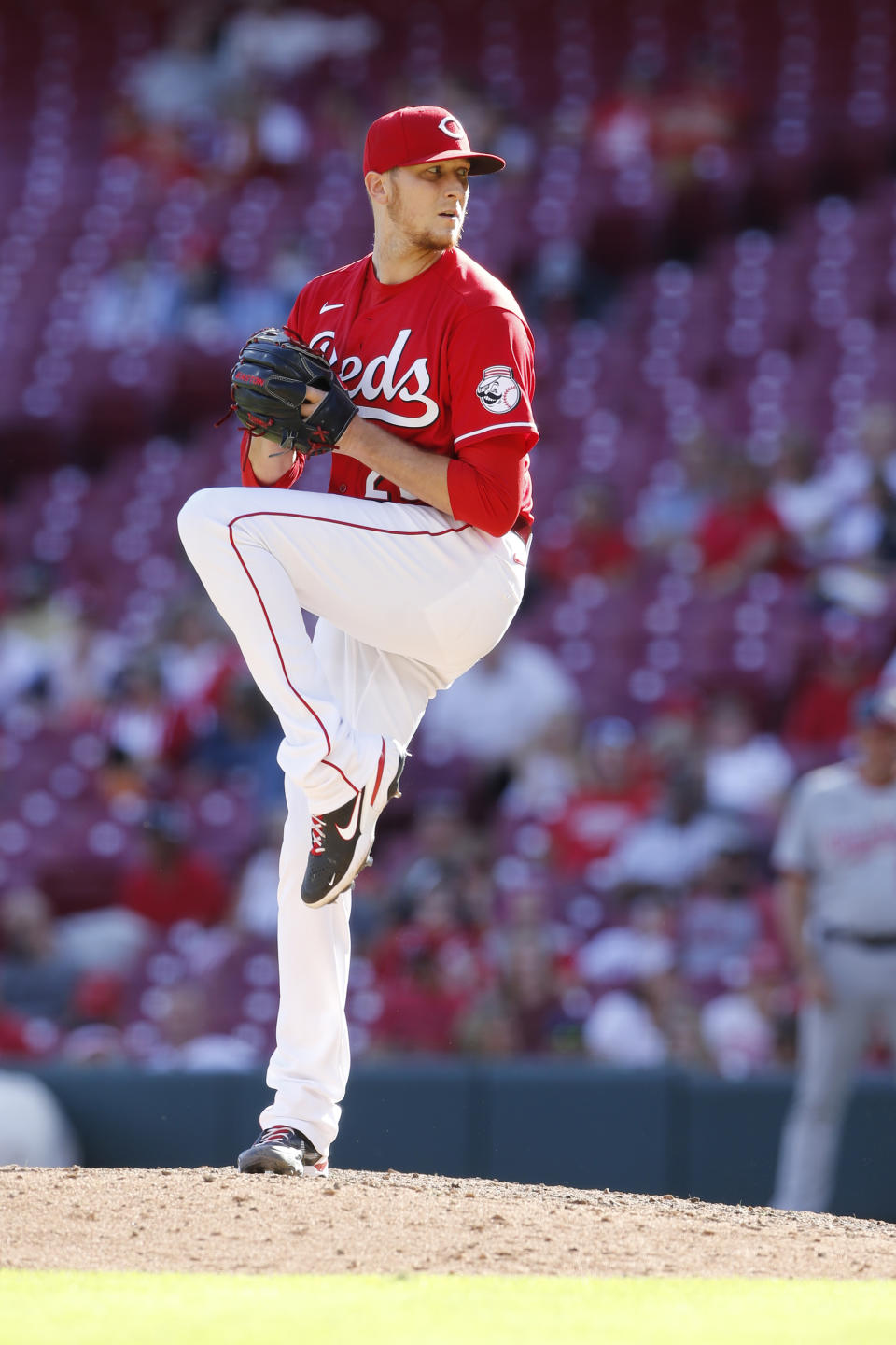 Cincinnati Reds' Jeff Hoffman winds up to pitch against the Washington Nationals during the ninth inning of a baseball game Sunday, Sept. 26, 2021, in Cincinnati. (AP Photo/Jay LaPrete)