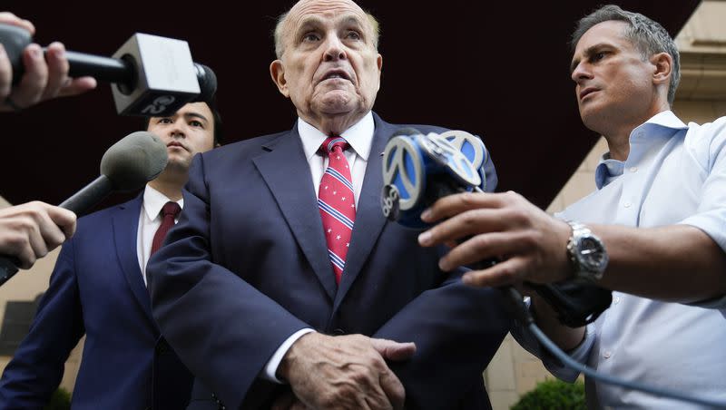 Former New York City Mayor Rudy Giuliani speaks to reporters as he leaves his apartment building in New York on Aug. 23, 2023.
