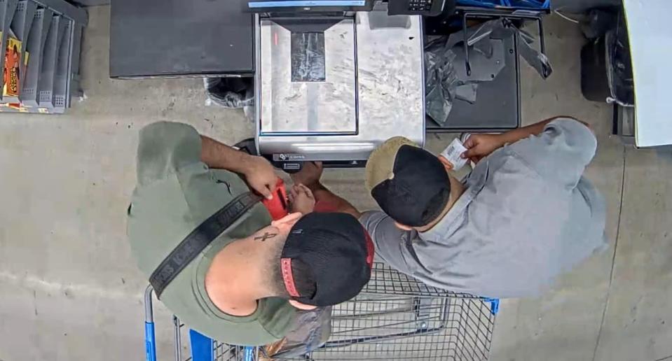 Police say these men installed a skimmer in Walmart.
