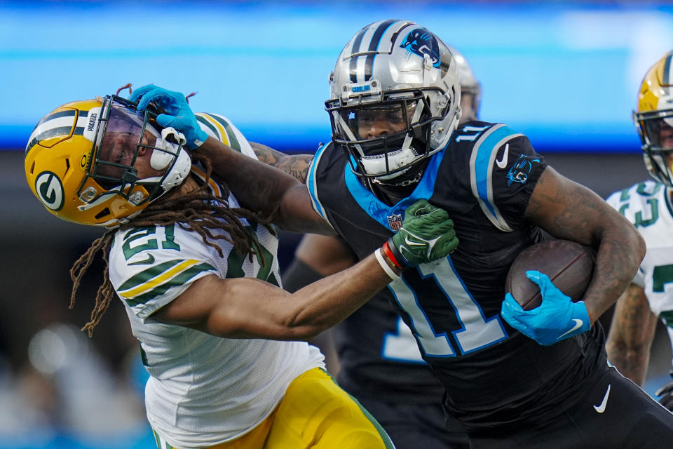 Carolina Panthers wide receiver Ihmir Smith-Marsette pushes off Green Bay Packers cornerback Eric Stokes during the second half of an NFL football game Sunday, Dec. 24, 2023, in Charlotte, N.C. (AP Photo/Rusty Jones)