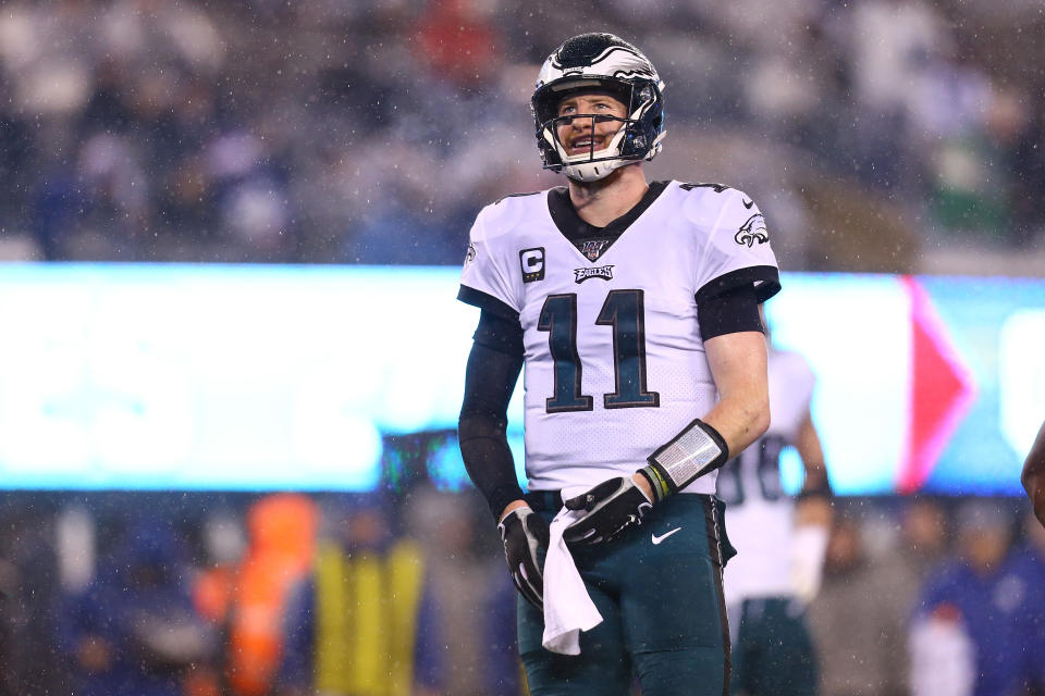 Carson Wentz will start his first playoff game on Sunday. (Photo by Mike Stobe/Getty Images)