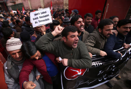 Activists of National Conference party, one of the Kashmir's main pro-India political parties, shout slogans during a protest against what the activists say is attacks on Kashmiris living outside their state, in Srinagar February 23, 2019. REUTERS/Danish Ismail