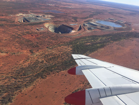 A plane flies above the Degrussa copper mine in Western Australia on August 5, 2018. REUTERS/Melanie Burton