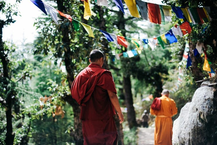 <span class="caption">The Buddha taught that happiness is one of the seven factors of Enlightenment.</span> <span class="attribution"><a class="link " href="https://www.pexels.com/photo/monk-walking-near-buntings-during-day-750896/" rel="nofollow noopener" target="_blank" data-ylk="slk:Pexels;elm:context_link;itc:0;sec:content-canvas">Pexels</a></span>