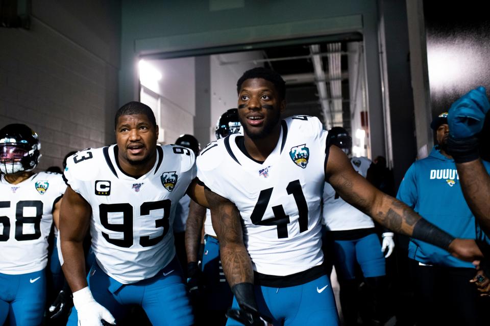 ATLANTA, GA - DECEMBER 22: Calais Campbell #93 stands alongside Josh Allen #41 of the Jacksonville Jaguars prior to taking the field to face the Atlanta Falcons at Mercedes-Benz Stadium on December 22, 2019 in Atlanta, Georgia. (Photo by Carmen Mandato/Getty Images)