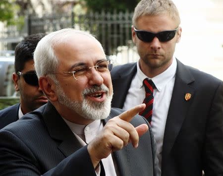 Iranian Foreign Minister Mohammad Javad Zarif talks to journalists as he arrives at his embassy in Vienna June 16, 2014. REUTERS/Heinz-Peter Bader