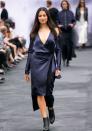Jessica Gomes in a jaw-dropping navy silk wrap dress by Dion Lee.