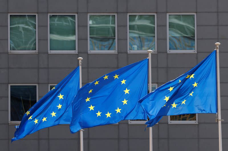 FILE PHOTO: European Union flags flutter outside the EU Commission headquarters in Brussels