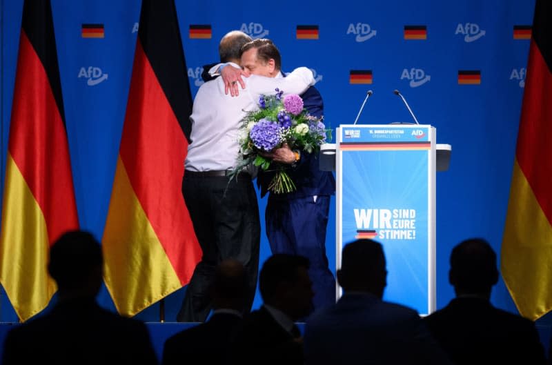 Kay Gottschalk (R) is congratulated by Peter Boehringer, deputy federal spokesperson, on his election as deputy federal spokesperson of the AfD at the Alternative for Germany (AfD) federal party conference in the Grugahalle in Essen. At the two-day party conference, the AfD plans to elect a new federal executive committee, among other things. Numerous organizations have announced opposition to the meeting and more than a dozen counter-demonstrations. Bernd von Jutrczenka/dpa