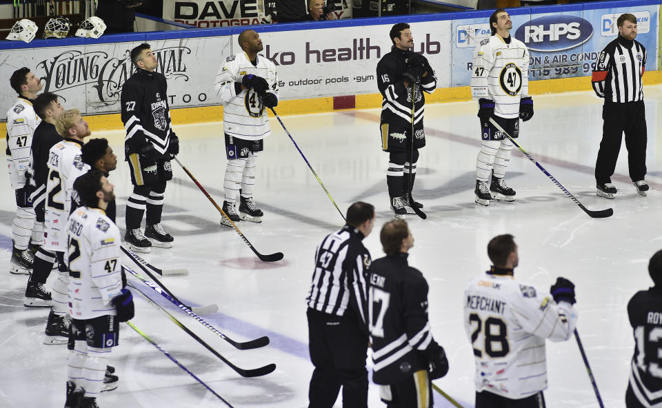Players pay tribute before the Ice Hockey Adam Johnson memorial game between Nottingham Panthers and Manchester Storm at the Motorpoint Arena, Nottingham, England, Saturday, Nov. 18, 2023. The memorial game is held three weeks after Adam Johnson, 29, suffered a fatal cut to his neck during a game against Sheffield Steelers on Saturday, October 28. (AP Photo/Rui Vieira)