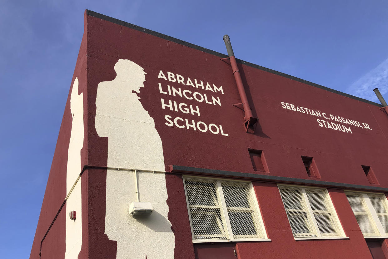 Abraham Lincoln High School is seen in San Francisco, on Jan. 27, 2021. The embattled San Francisco school board is poised to reverse a decision to rename 44 schools in an effort to avoid costly litigation and tone down national criticism. In a Tuesday, April 6, 2021, meeting, the board will vote on a resolution to rescind a controversial January decision to rename schools and revisit the matter after all students have returned full-time to in-person learning. (AP Photo/Haven Daley)