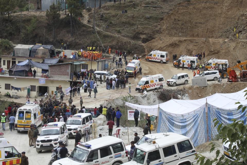 Ambulances wait to carry workers from the site of an under-construction road tunnel that collapsed in Silkyara in the northern Indian state of Uttarakhand, India, Tuesday, Nov. 28, 2023. Officials in India said Tuesday they were on the verge of rescuing the 41 construction workers trapped in a collapsed mountain tunnel for over two weeks in the country's north, after rescuers drilled their way through debris to reach them. (AP Photo)