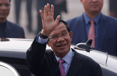 Cambodia's Prime Minister Hun Sen waves upon his arrival at Air Force Station Palam in New Delhi, India, January 24, 2018. REUTERS/Adnan Abidi