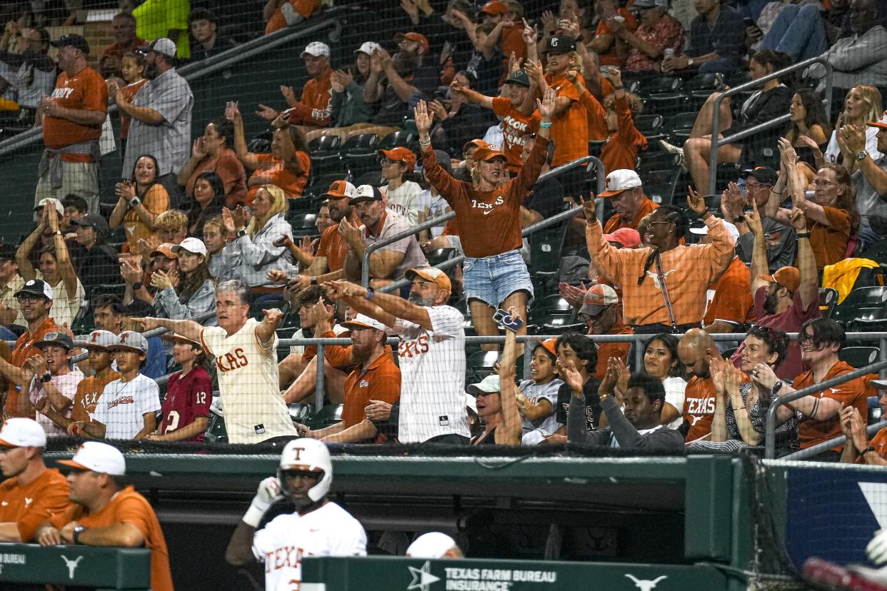 Texas Longhorns fans celebrate a play review that resulted in an out during the game against Oklahoma State at UFCU Disch–Falk Field on Friday, May. 3, 2024 in Austin.