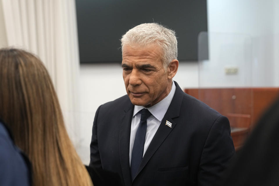 Israeli opposition leader Yair Lapid arrives to testify at the trial of Prime Minister Benjamin Netanyahu on corruption charges at the Jerusalem District Court, in east Jerusalem, Monday, June 12, 2023. (AP Photo/Ohad Zwigenberg)