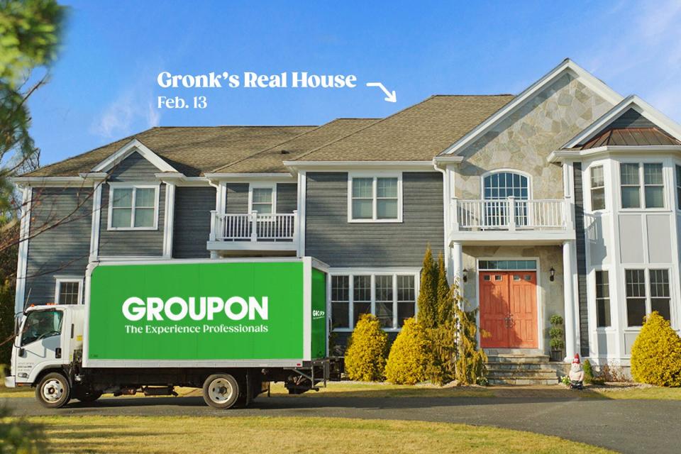 Exterior house view with green Groupon truck