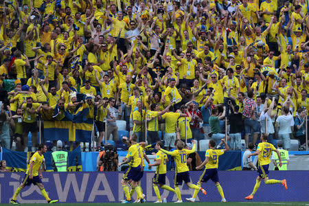 Soccer Football - World Cup - Group F - Sweden vs South Korea - Nizhny Novgorod Stadium, Nizhny Novgorod, Russia - June 18, 2018 Sweden's Andreas Granqvist celebrates scoring their first goal in front of fans with team mates REUTERS/Ivan Alvarado