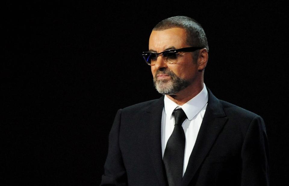George Michael presented onstage during the BRIT Awards 2012.