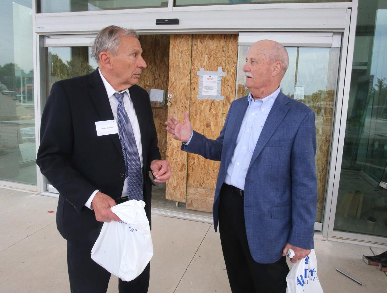 Canton Mayor Thomas M. Bernabei, left, speaks with Michael E. Hanke, Aultman Health Foundation board member, after a tour of Aultman's Timken Family Cancer Center in Canton in June 2022.