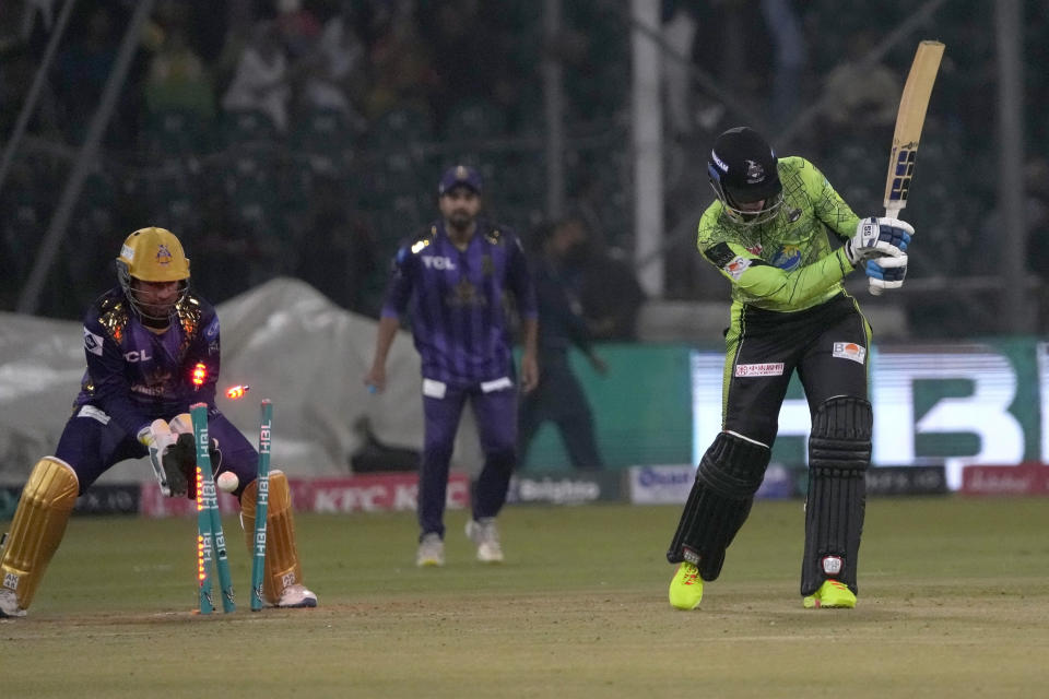 Lahore Qalandars' Rassie van der Dussen, right, is bowled out by Quetta Gladiators' Abrar Ahmed during the Pakistan Super League T20 cricket match between Quetta Gladiators and Lahore Qalandars, in Lahore, Pakistan Monday, Feb. 19, 2024. (AP Photo/K.M. Chaudary)