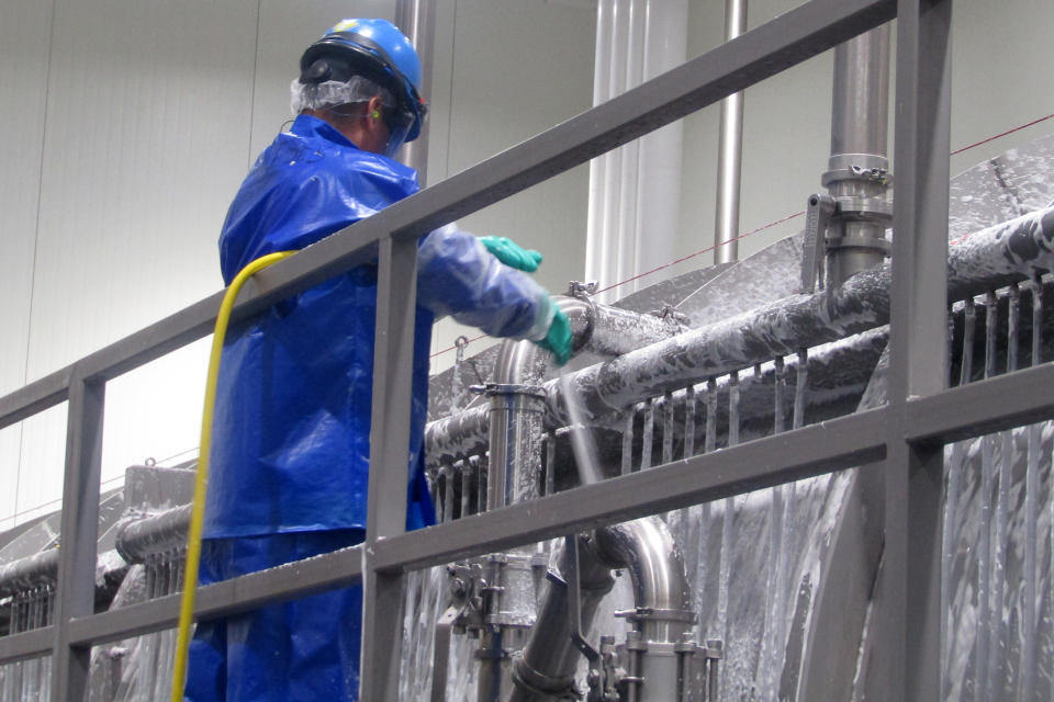 A PSSI worker cleans a chicken chiller at the House of Raeford poultry processing plant after Antonio Fonseca-Gutierrez was killed. Inspectors from the North Carolina Department of Labor came to investigate PSSI's operations at the plant after his death. The workers did not climb into the machine when inspectors were there but the agency still found violations. (North Carolina Dept. of Labor)