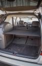 <p>While still more capacious than a Porsche 911, the ML55's side-mounted spare tire ate up precious space in its cargo hold. </p>