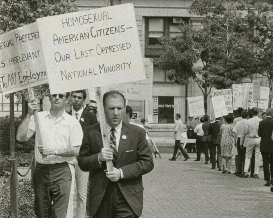 Frank Kameny leads a picket line holding a sign in front of Independence Hall in Philadelphia on July 4, 1965.