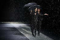 Models wear creations part of the Emporio Armani women's Fall-Winter 2024-25 collection presented in Milan, northern Italy, Thursday, Feb. 22, 2024. (AP Photo/Luca Bruno)