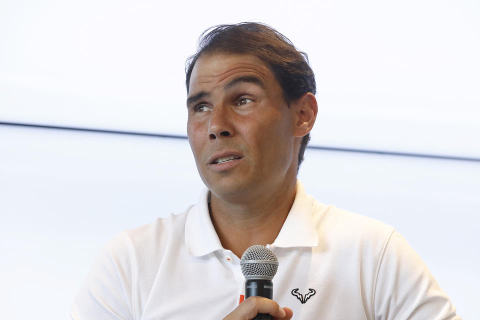 FILE - Spain's Rafael Nadal speaks during a news conference at his tennis academy in Manacor, Mallorca, Spain, Thursday May 18, 2023. Nadal had arthroscopic surgery on Friday, June 2, 2023, for the injured left hip flexor that forced him to sit out the French Open for the first time since he won the first of his record 14 titles there in his 2005 tournament debut. (AP Photo/Francisco Ubilla, File)