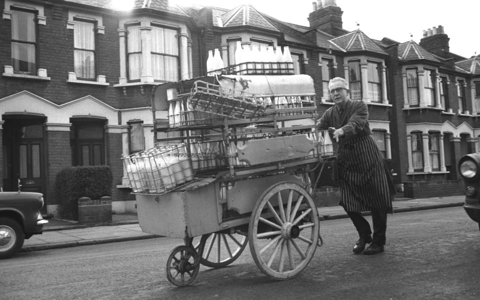 A milkman does his rounds in London's East End during the 1960s. (Photo by Steve Lewis/Getty Images)  - Getty