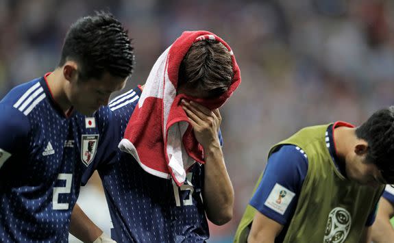 Japan's team bowed to fans, despite their obvious heartbreak.