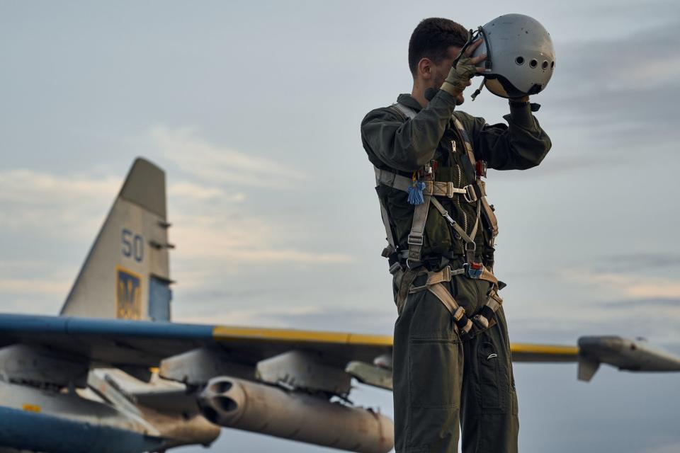 A Ukrainian Su-25 pilot prepares for a combat flight on August 1, 2023, in eastern Ukraine. <em>Photo by Libkos/Getty Images</em>