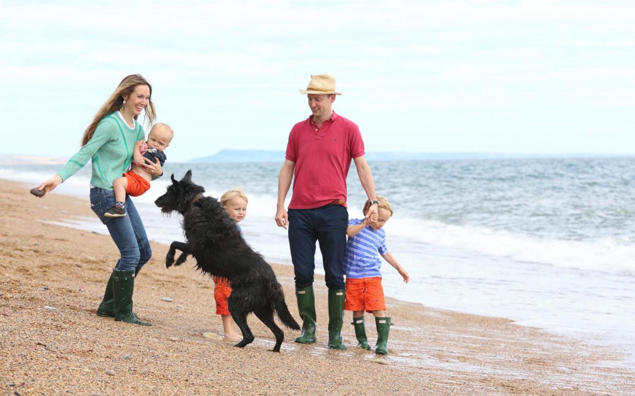 Anna with her family and lurcher in Devon - TMG John Lawrence