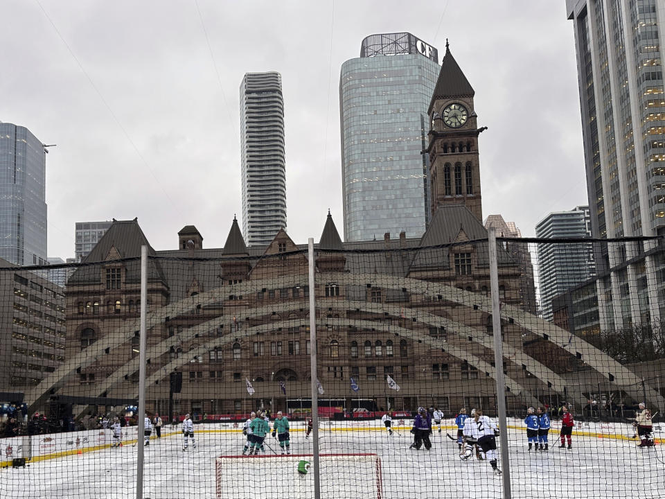 Professional Women’s Hockey League players skate outdoors at Nathan Phillips Square in Toronto, Thursday, Feb. 1, 2024, ahead of their 3-on-3 showcase at NHL All-Star Weekend. (AP Photo/Stephen Whyno)