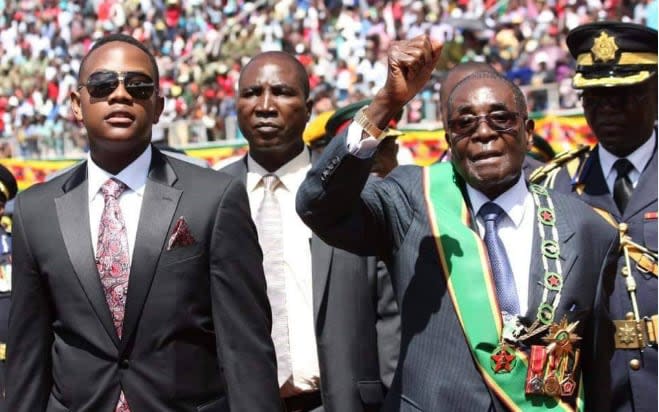 Robert Mugabe with his youngest son Chatunga Bellarmine Mugabe (left) - Robert Mugabe with his son Chatunga Bellarmine Mugabe (left)/Facebook 