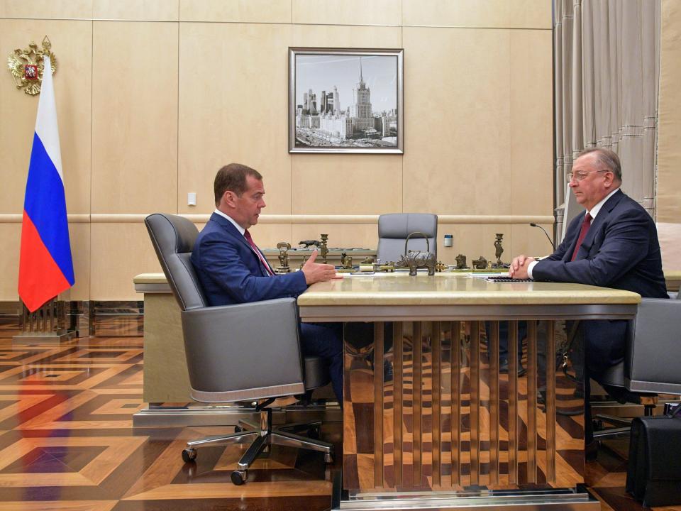 Russia's Prime Minister Dmitry Medvedev (L) and Nikolai Tokarev, chairman of the Board, president at Transneft, during a 2019 meeting.