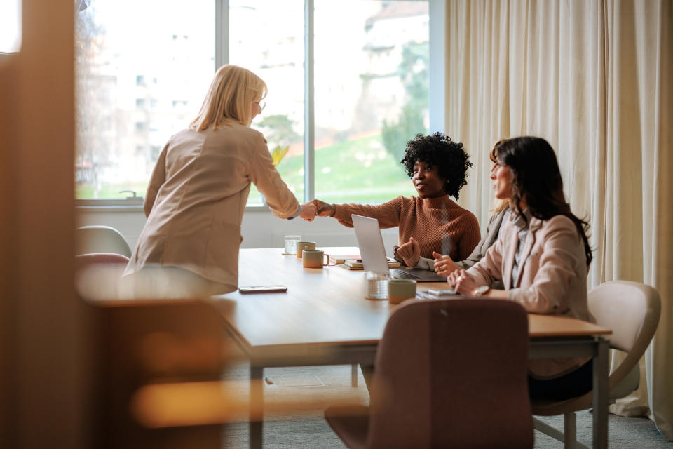 people shaking hands in a job interview